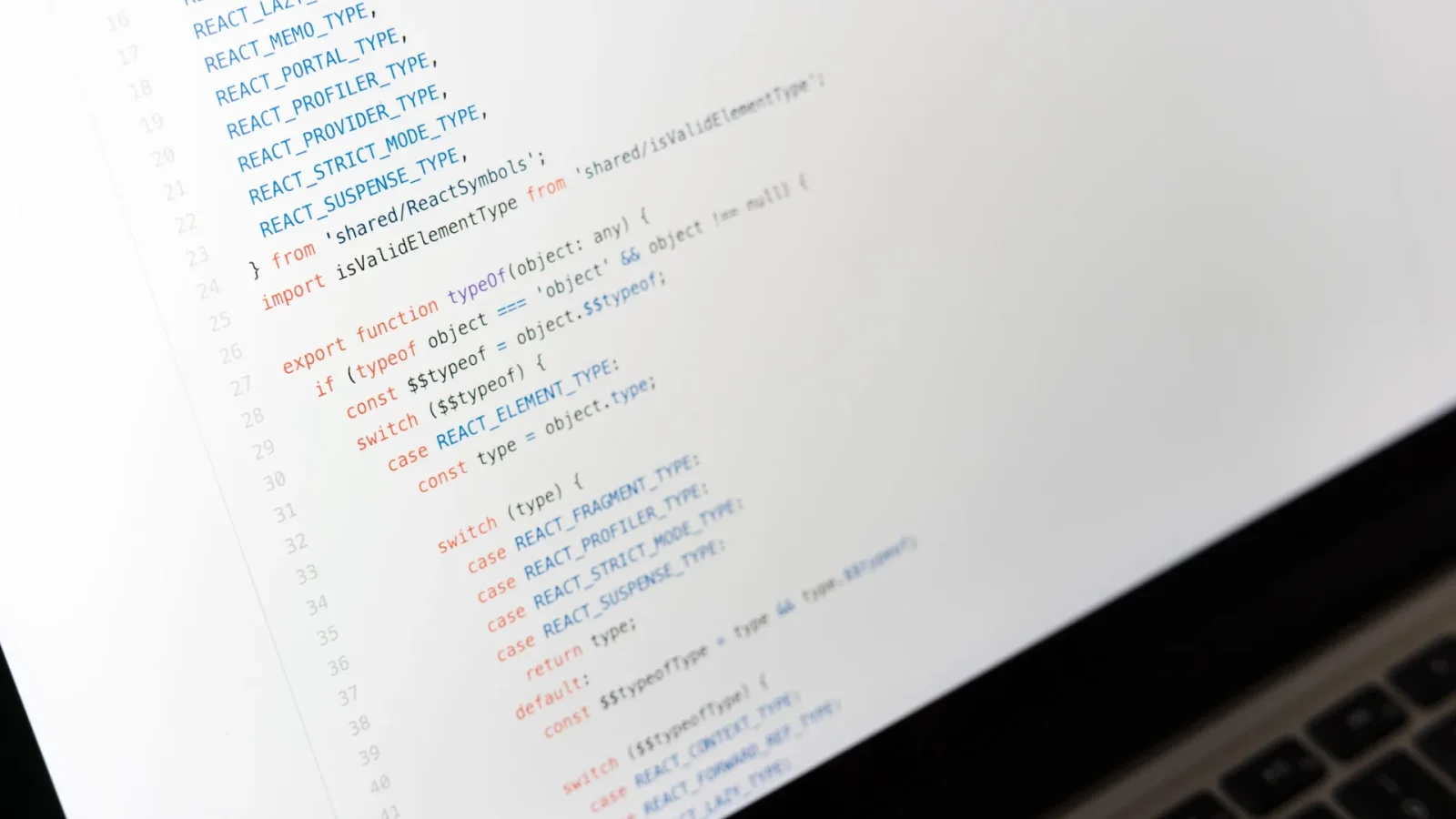 Close-up of JavaScript code on a laptop screen, showcasing programming in progress.