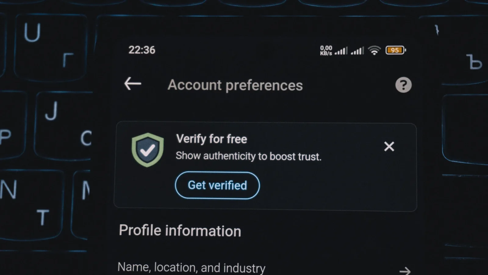 Close-up of a smartphone screen displaying account verification alert. Ideal for security and authenticity themes.